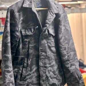 Button up light black
And gray camo coat by Lucky.